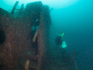 Fototapeta na wymiar Scuba diver exploring a shipwreck (La Paz, Baja California Sur, Mexico)