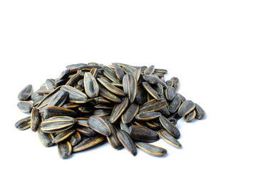 Sunflower seeds on white background. Food and flower concept. Isolated