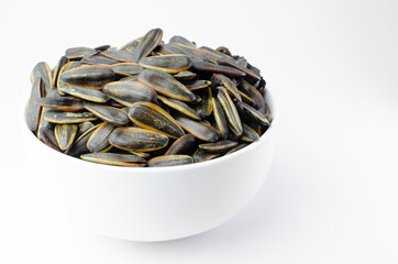 Sunflower seeds on white background. Food and flower concept. Isolated
