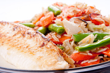 seared tilapia fish filet with rice stir fry