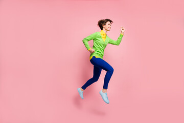 Fototapeta na wymiar Full body profile side photo of woman jump up run copyspace sale wear blue trousers isolated on pink color background