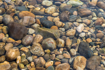 Many colors stones under sea clean water