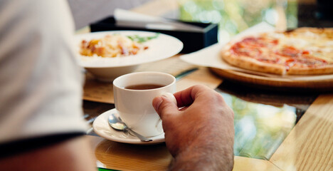 person holding a cup of coffee