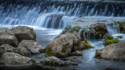 Fontaine de vaucluse ,showing one of the many waterfalls , provence France .