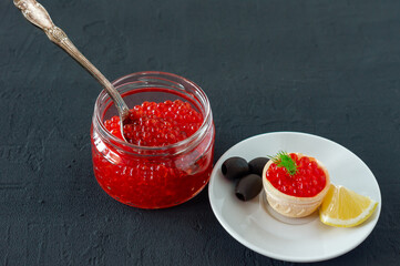 Tartlets with butter and red caviar. Gourmet food, appetizer. Delicatessen. Seafood.