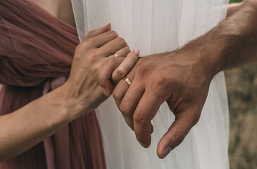 Hands of man and woman with rings