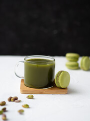 Tea Matcha with macaroon and steam