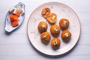 Traditional spanish croquettes from mallorca with sobrassada and cheese