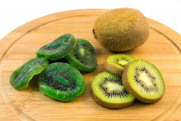 The healthy kiwi fruit is fresh and dried on a wooden kitchen board