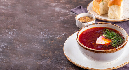 Russian borsch with sour cream and buns. Beetroot soup. Copy space, top view