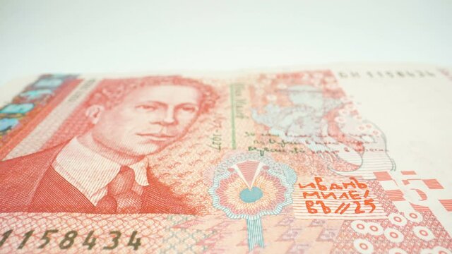 The 5 Bulgarian lev paper bill on the table with the face image on it