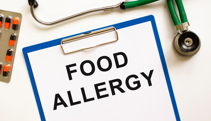 Text FOOD ALLERGY in the folder with the stethoscope. Medical concept.