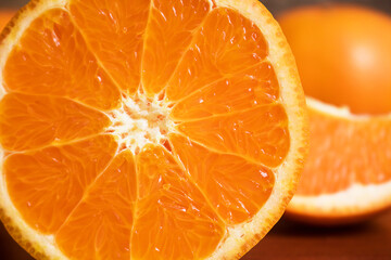 Close-up Fresh half orange on wooden table.