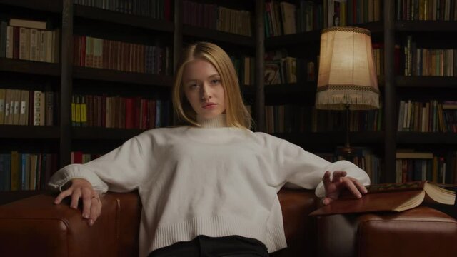 Young woman waiting in a chair