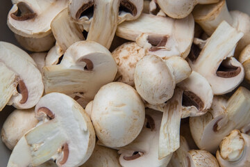 Whole and sliced fresh mushrooms and champignons