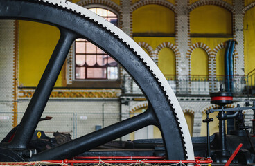 Old steam machine, steam pump wheel. Industrial historic heritage