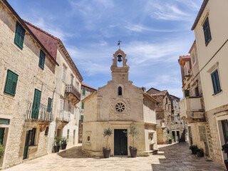 Small church on square of small urban village of Stari grad on Hvar island in Croatia, Adriatic...