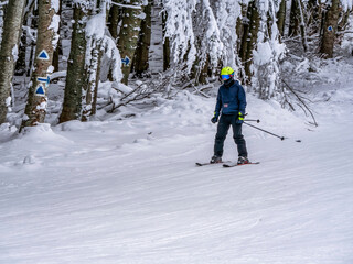 Skier enjoying skiing on the Clabucet ski lope in Predeal Mountain resort in Romania