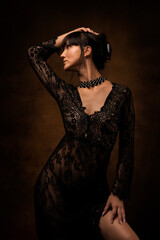 Sexy woman posing in black lace lingerie. The boudoir fantasy image of a sensual beautiful lady has returned to erotic underwear. Hot female model.
