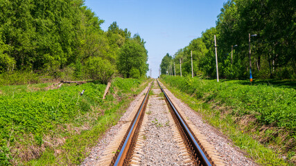 The railway going into the distance on a summer sunny day.