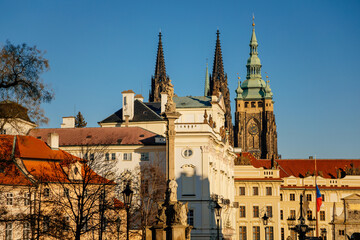 Castle from Hradcany Square, spiers of st Vitus cathedral, archbishop's palace and Marian Plague Column, sunny winter day, Hradcanske namesti, Prague, Czech Republic