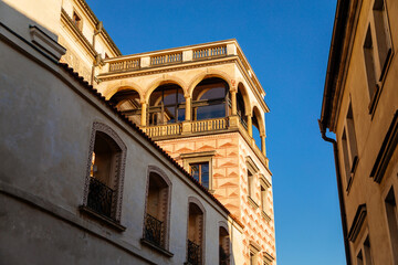 Fototapeta premium Beautiful renaissance balcony is richly decorated with figural sgraffito, view from Town hall stairs, Hradcany district in sunny day, Prague, Czech Republic