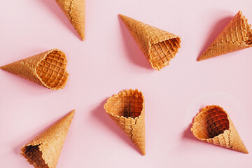 .top view of empty waffle cups on pink background