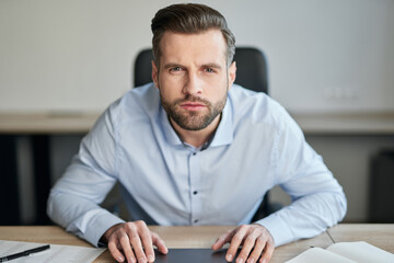 Man leaning forward while trying to notice something