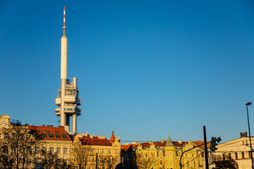 Panoramic view of Prague with red roofs and Zizkov television tower or Zizkovska vez in the background, Iconic tower in sunny day, Prague, Czech Republic