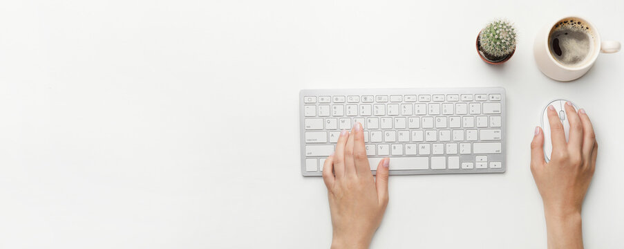 Female hands with computer keyboard and mouse on white background with space for text