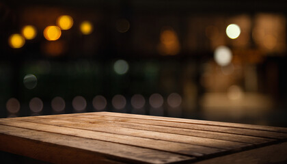 Wooden table top on blurred shop window of cafe with light bulb. Background for product display...