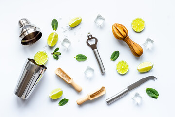 Bar utensils and tools for Mojito cocktail - shaker, lime and ice