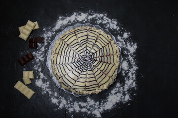 Gourmet esterhazy cake on a dark background top view. Delicious dessert with chocolate, copy space from the right