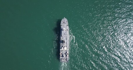 Aerial view of naval ship, battle ship, warship, Military ship resilient and armed with weapon systems, though armament on troop transports. support navy ship. Military sea transport.