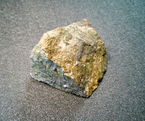 the mineral is a stone chip with yellow inclusions