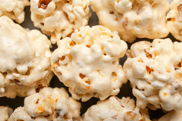 Tasty popcorn balls as background