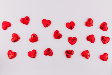 background of red hearts on a white background for the feast of lovers Valentine's day February 14