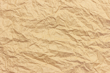 The texture of crumpled brown craft paper.