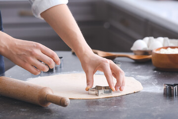 Woman making cookies in kitchen