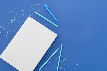 Blank magazine and stationary on color background