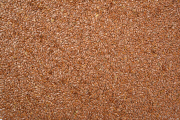 texture of dry brown flax seeds, top view