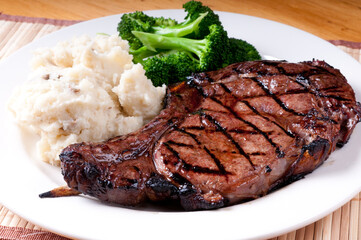 bbq rib steak with garlic mashed potatoes and brocolli