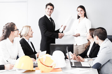 Business handshake at negotiations in office