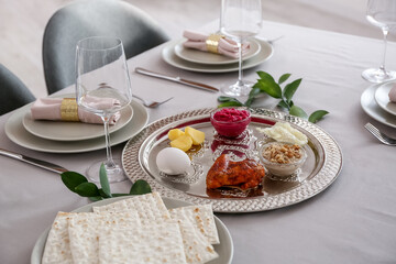 Passover Seder plate with traditional food on served table