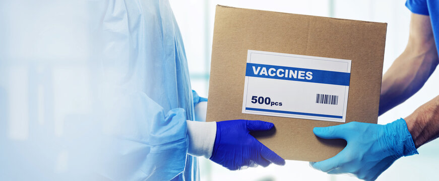 medical products supply - healthcare worker accepting package delivery of vaccines from deliveryman. copy space