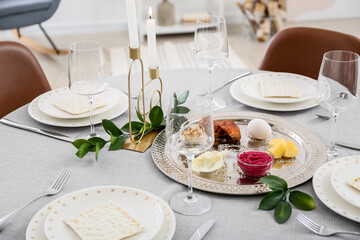 Passover Seder plate with traditional food on served table