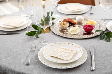 Jewish flatbread matzo on table setting for Passover Seder