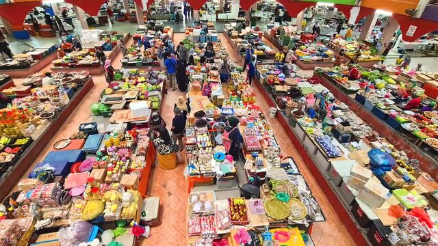 Multi-Colored Food And Walls In Large Indoor Market In Kota Bharu Kelantan - Tilt Down