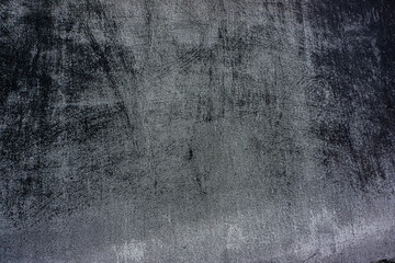 surface of the wall plaster with scratches and paint residues.
