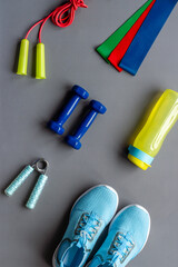 Naklejka premium Flat lay of sport fitness equipments with sneakers and dumbbells